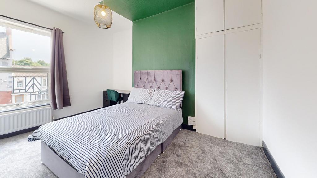 A stylish and inviting double bedroom featuring...