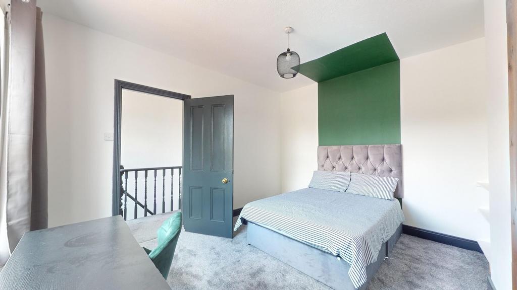 A stylish and inviting double bedroom featuring...