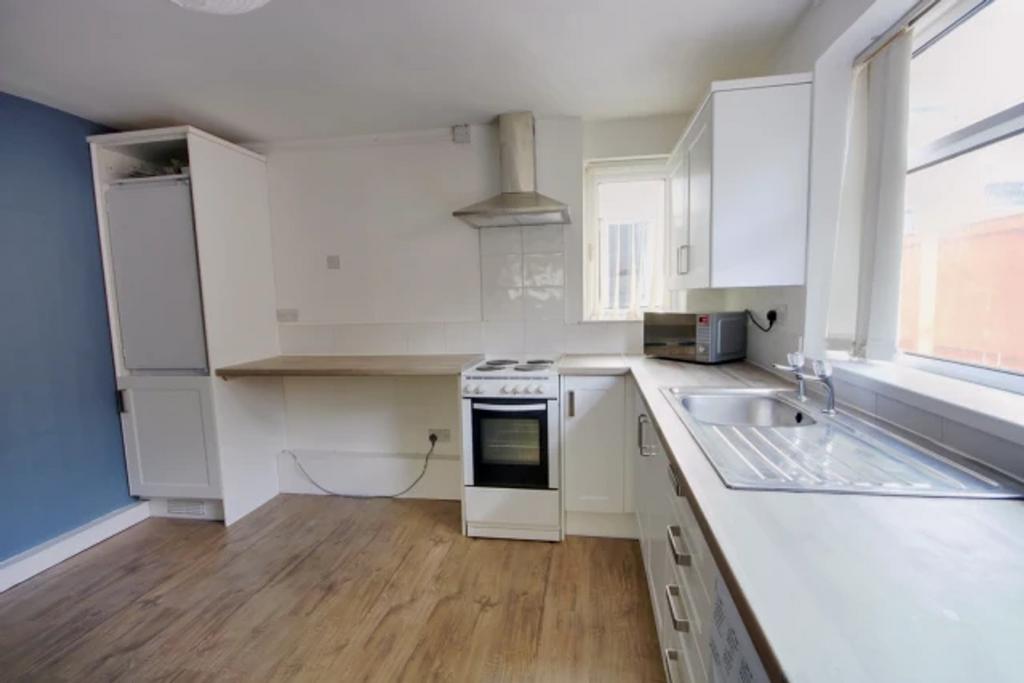 A bright and spacious kitchenette featuring mod...