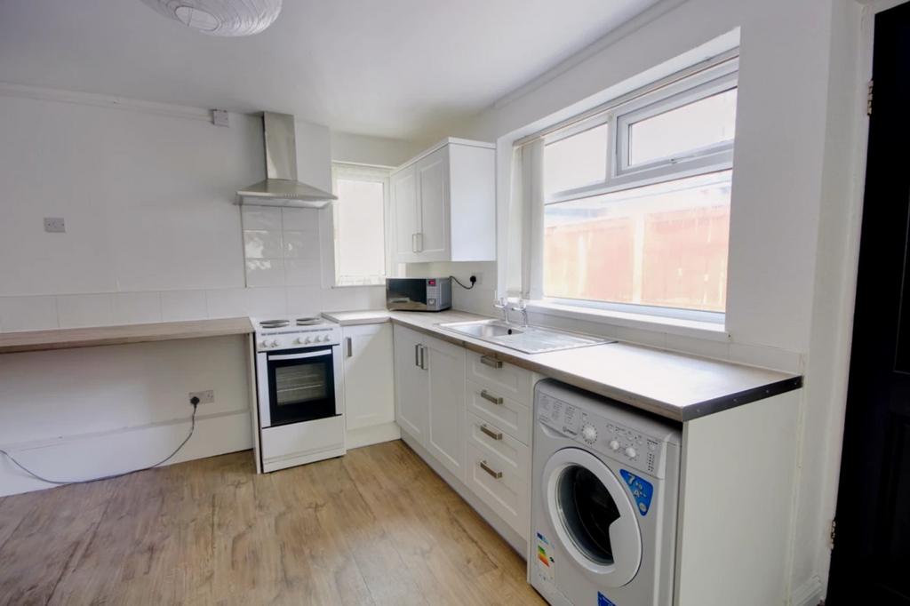 A bright and spacious kitchenette featuring mod...