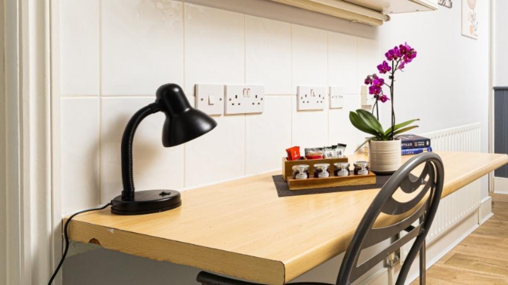 A bright and tidy kitchenette featuring modern ...