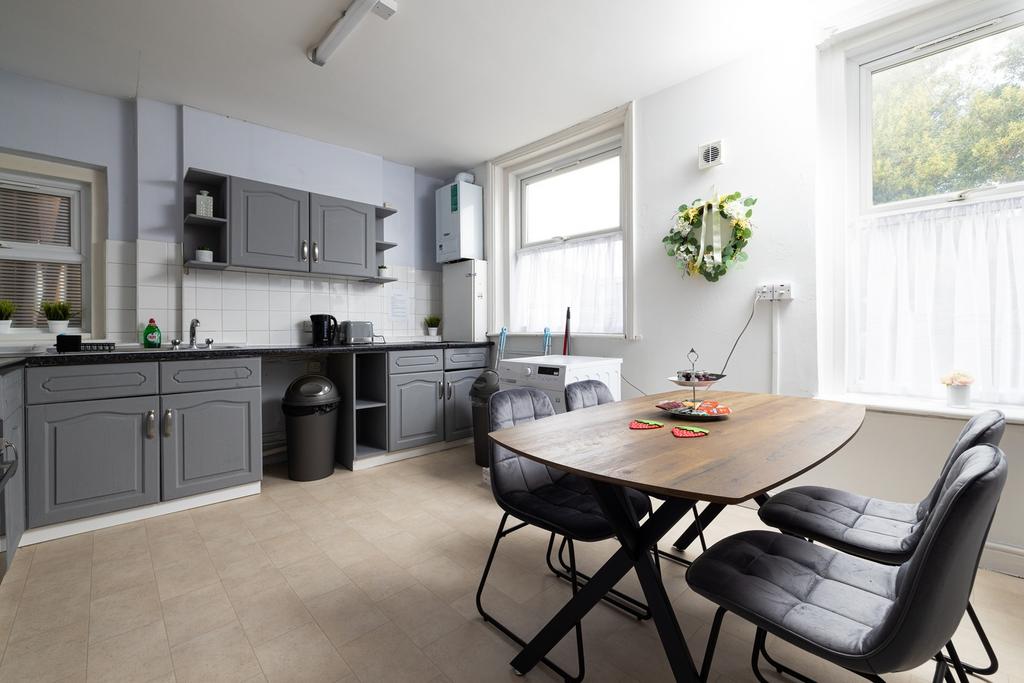 A bright and spacious kitchen with modern ameni...