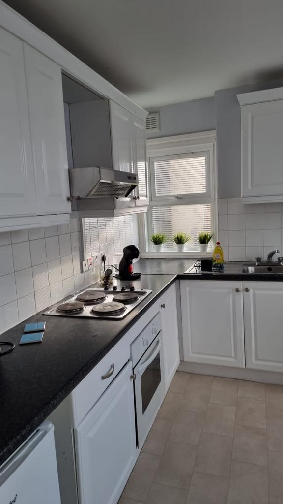 A bright and tidy kitchenette featuring modern ...