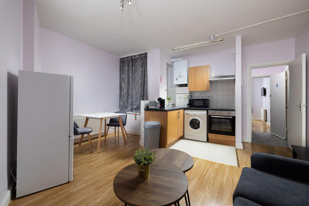 A bright and spacious kitchenette featuring mod...