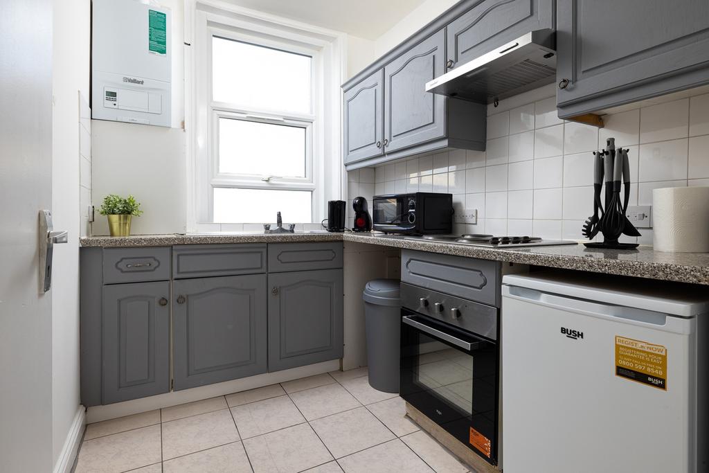 A clean and modern kitchenette with ample space...