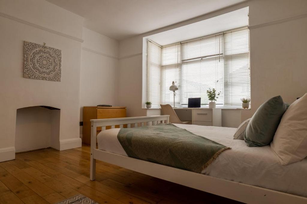 A bright and inviting double bedroom with ample...