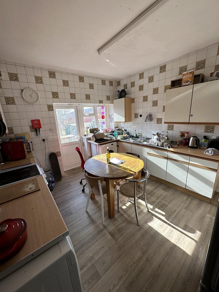 A bright and spacious kitchen with ample natura...