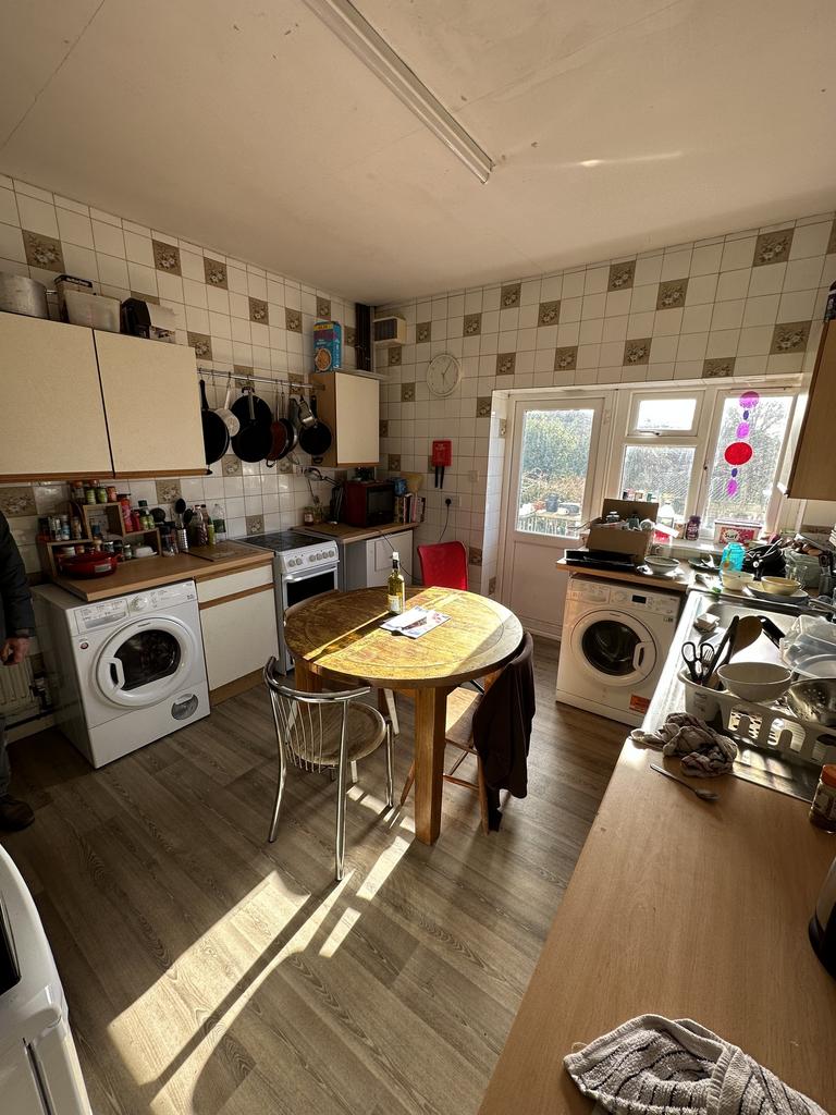 A bright and spacious kitchen with ample counte...