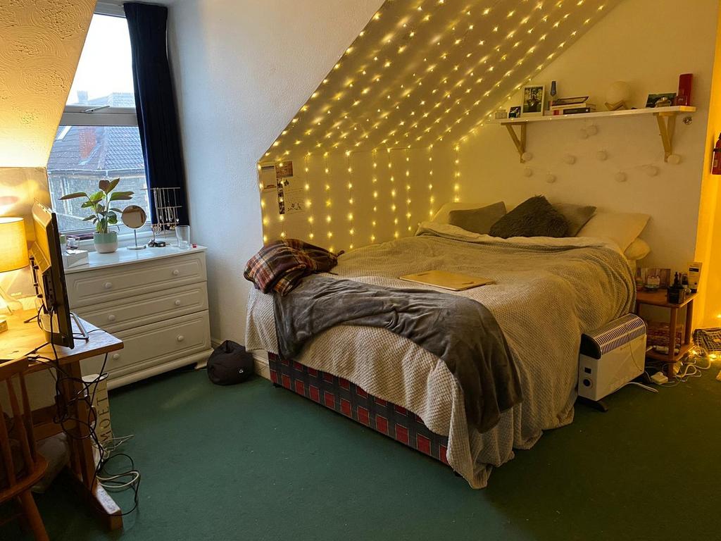 A bright and inviting large double bedroom deco...