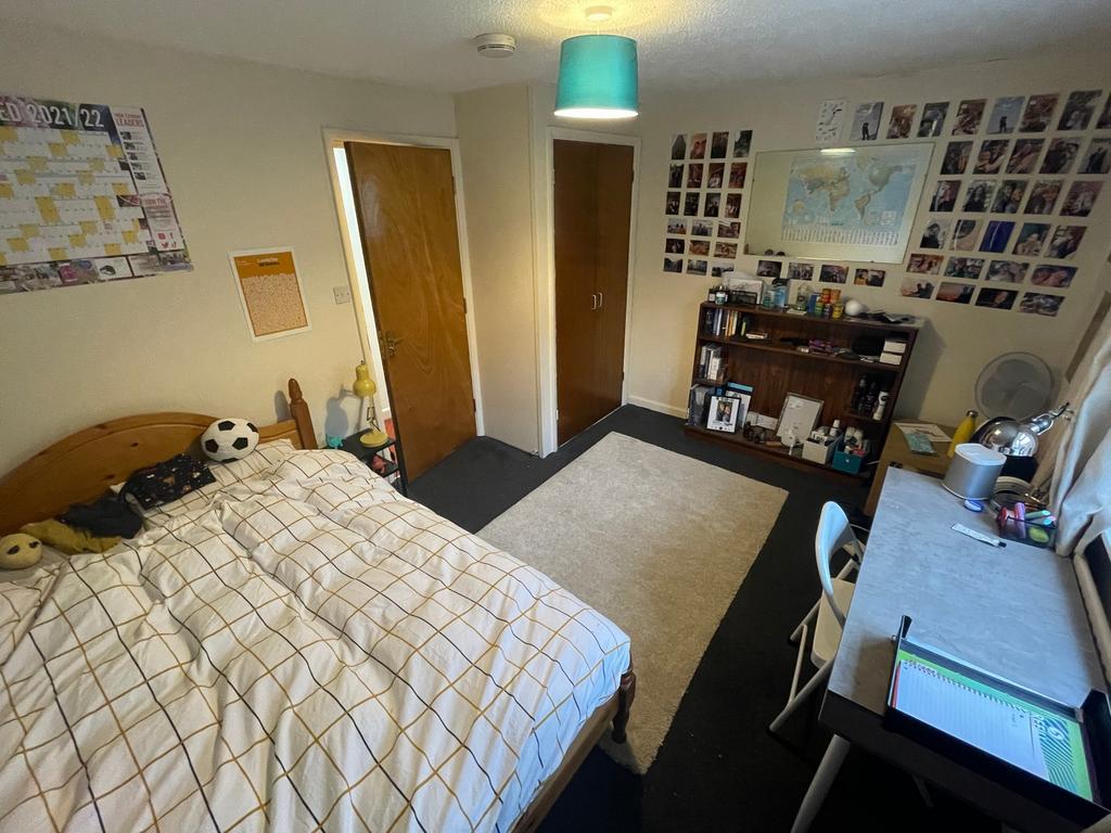 A spacious and inviting double bedroom, perfect...