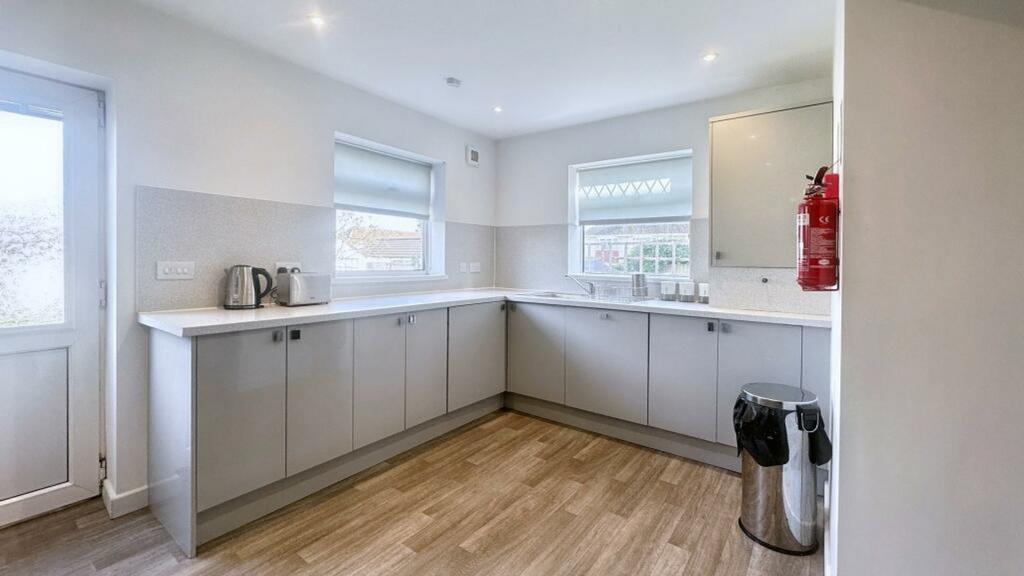 A modern and clean kitchenette with ample space...