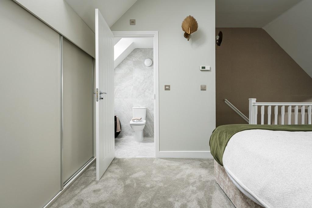 The master bedroom features an en suite &amp; built...