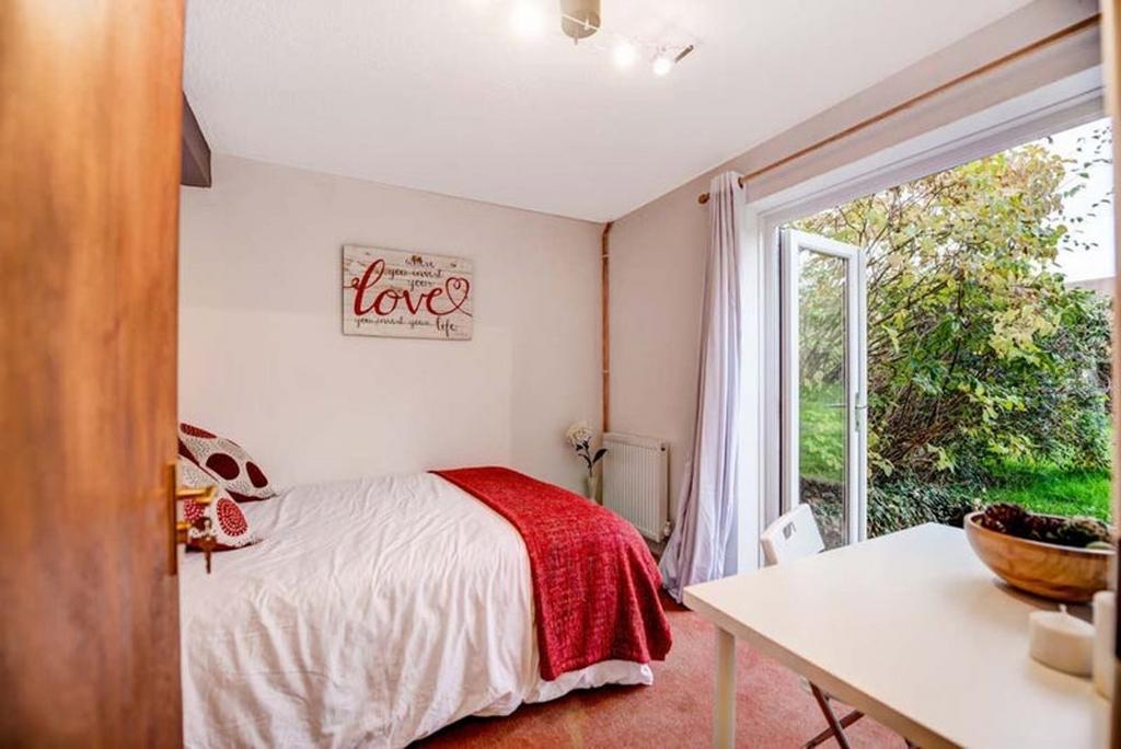 A bright and inviting double bedroom featuring ...