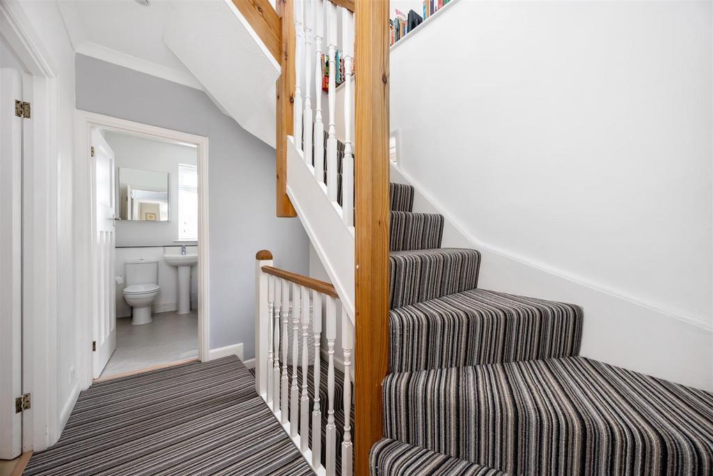 Stairs rising to Second Floor