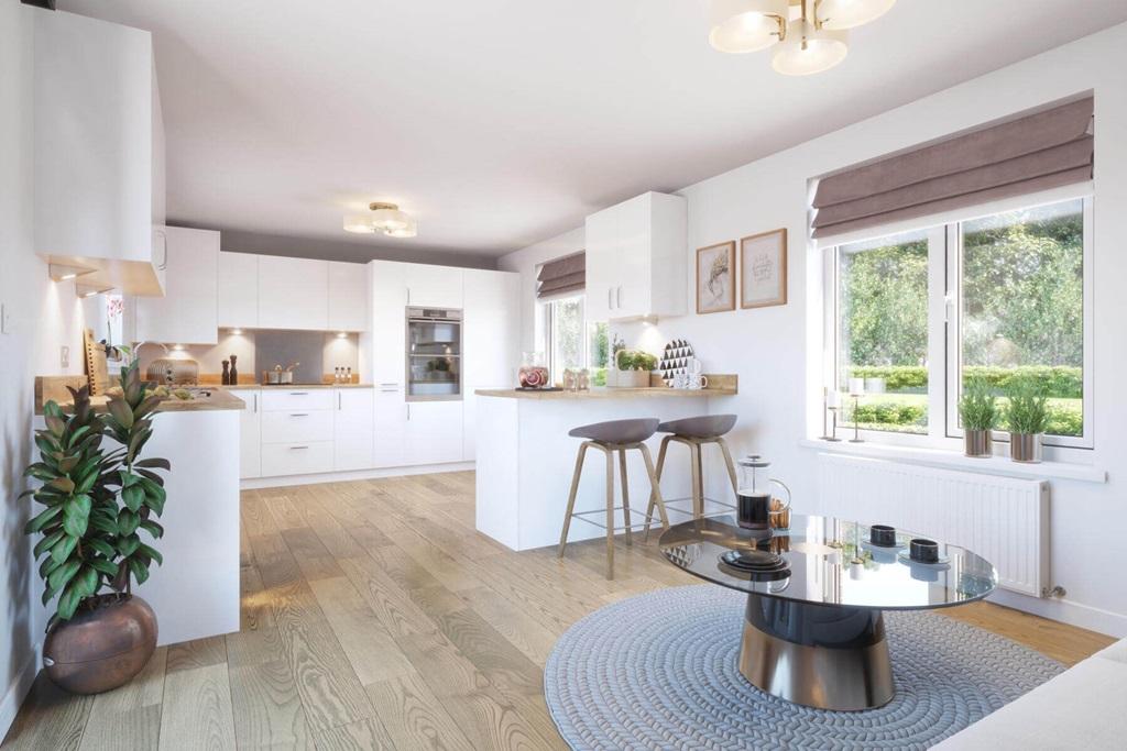 A bright and airy kitchen and dining area leads...