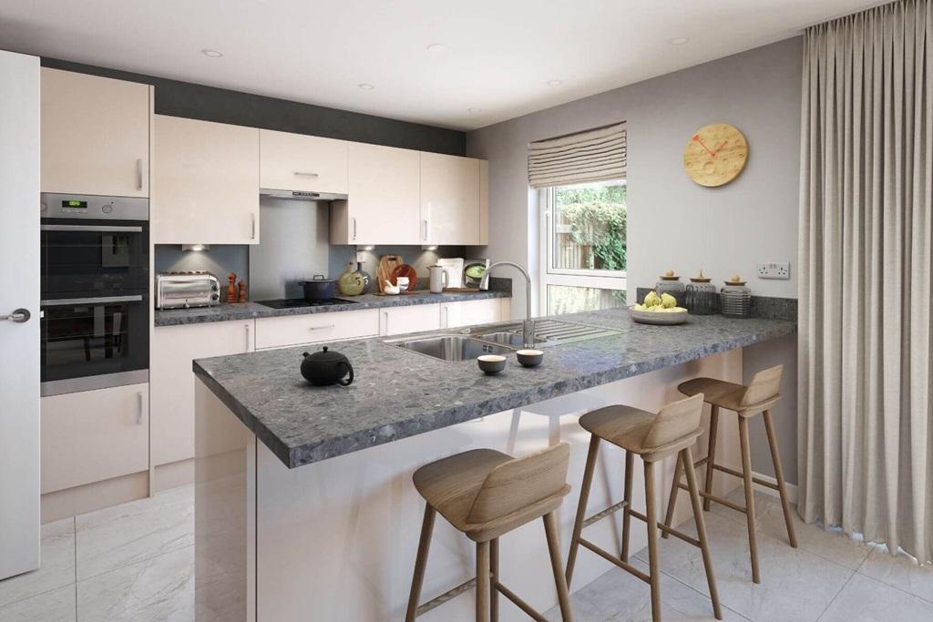 The peninsula kitchen layout divides the area...