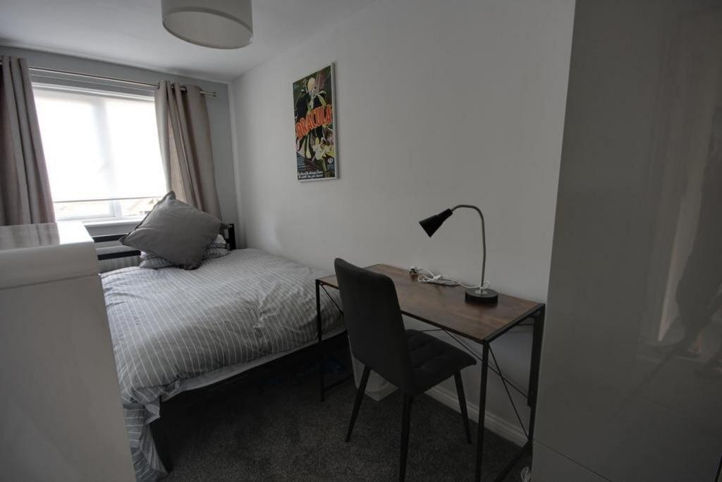 A bright and tidy double bedroom featuring a co...