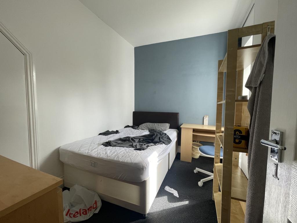 A bright and inviting double bedroom featuring ...