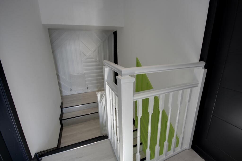 A bright and clean staircase leading to the upp...