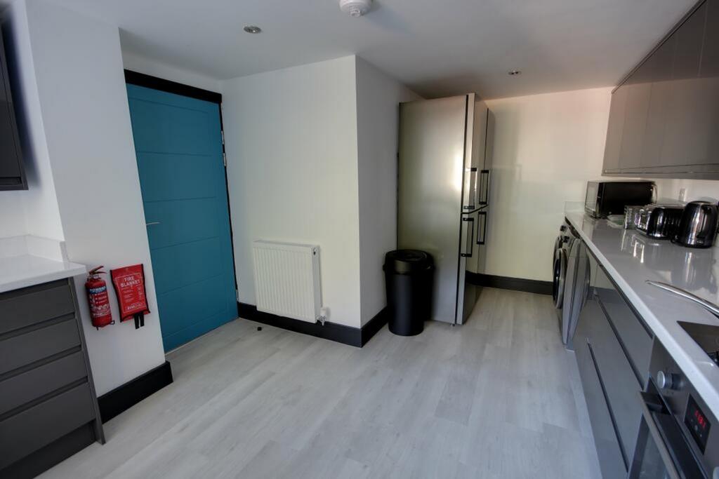 A bright and modern kitchenette with sleek appl...