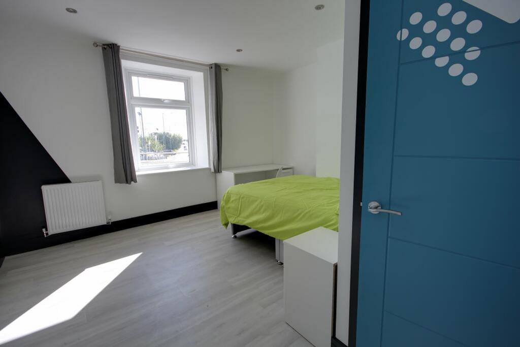 A bright and spacious double bedroom featuring ...