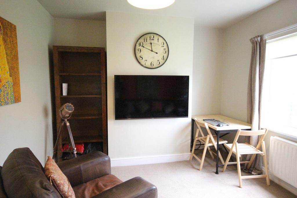 A bright and inviting living room with modern d...