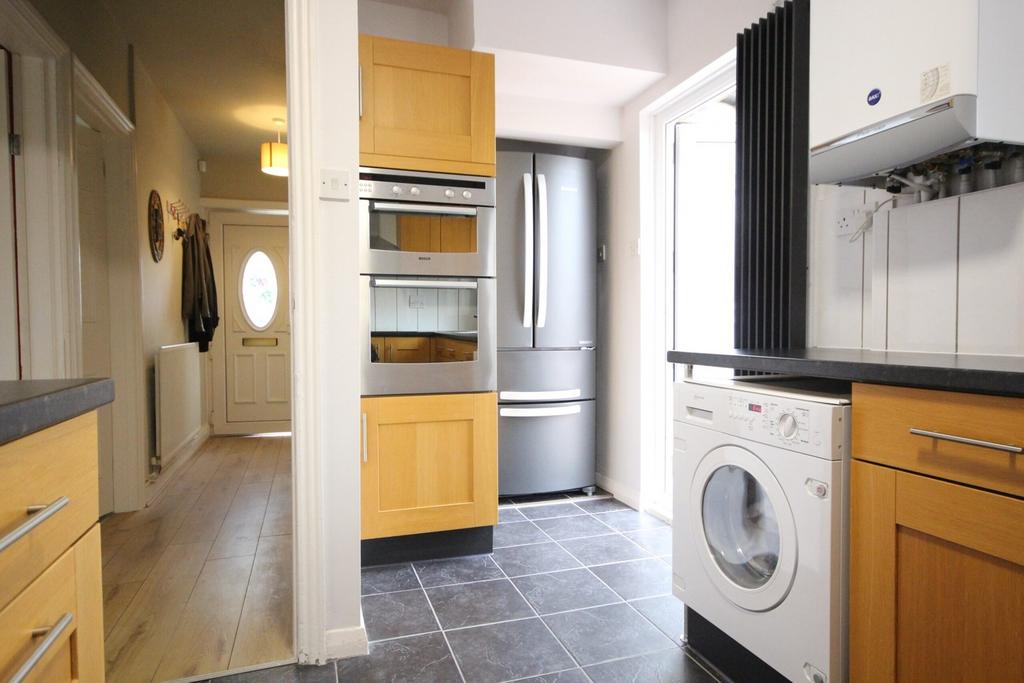 A modern and well-equipped kitchenette featurin...