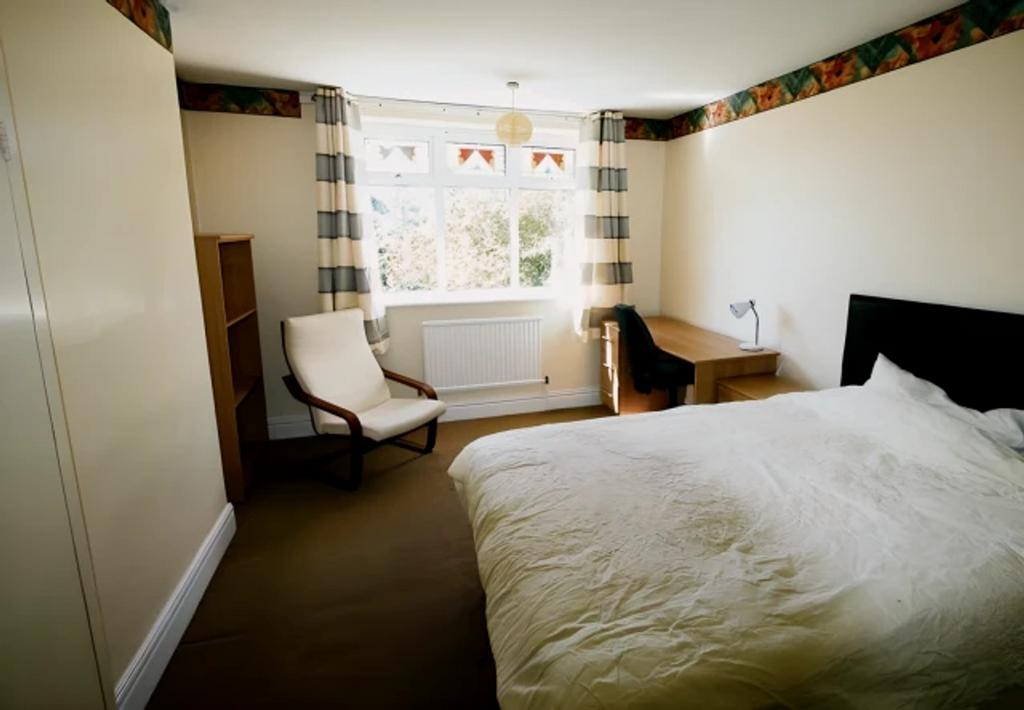 A bright and spacious double bedroom featuring ...