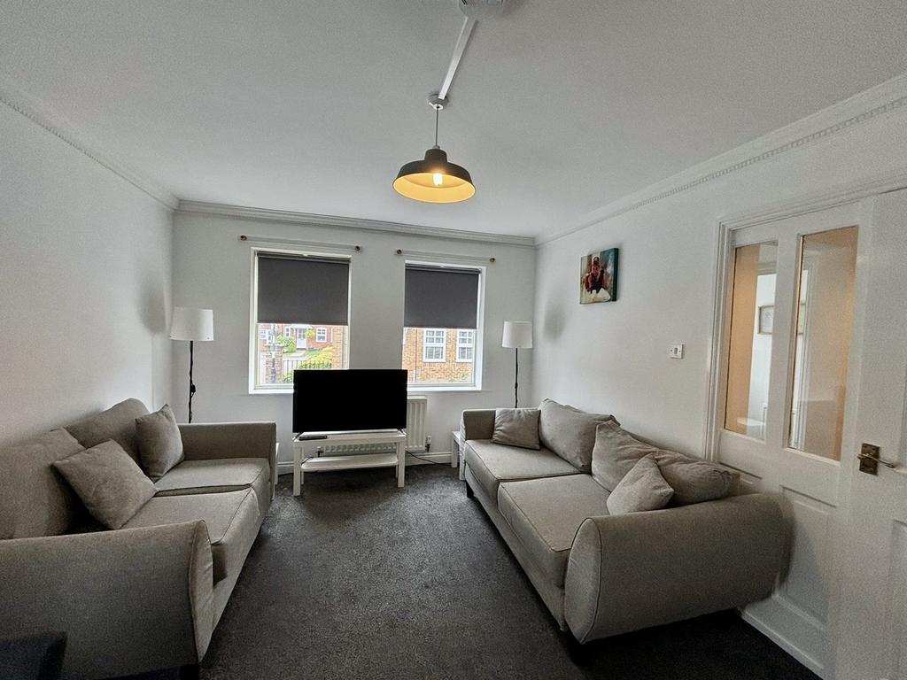 A bright and spacious modern living room, perfe...