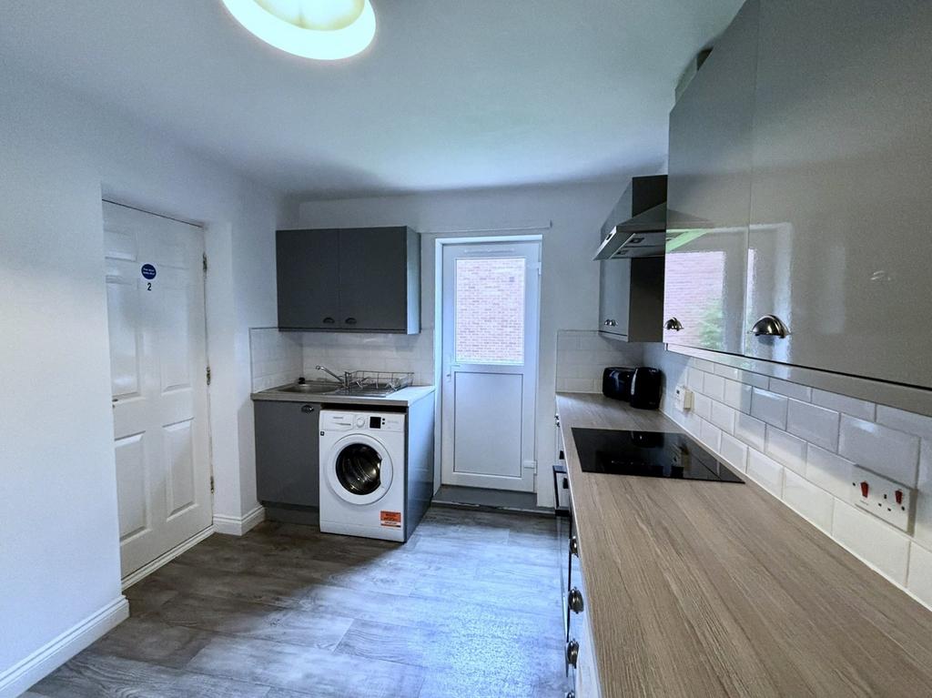 A modern and tidy kitchenette featuring essenti...