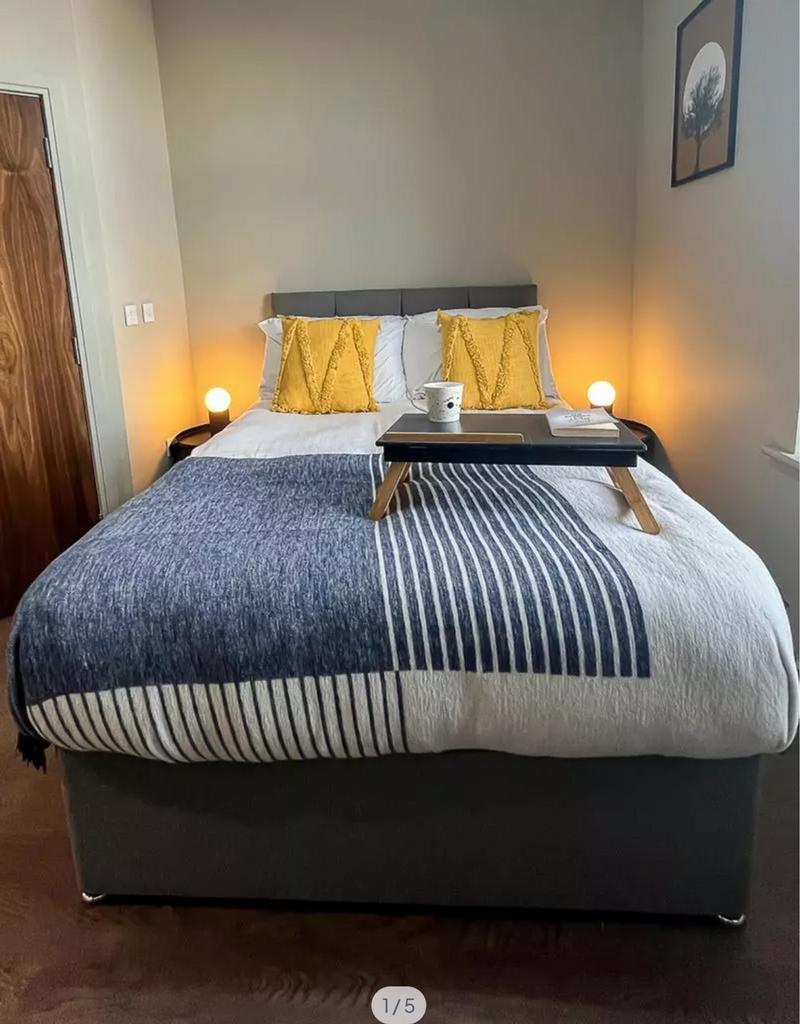 A stylish and inviting double bedroom featuring...