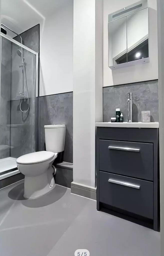 A modern and clean bathroom featuring a stylish...