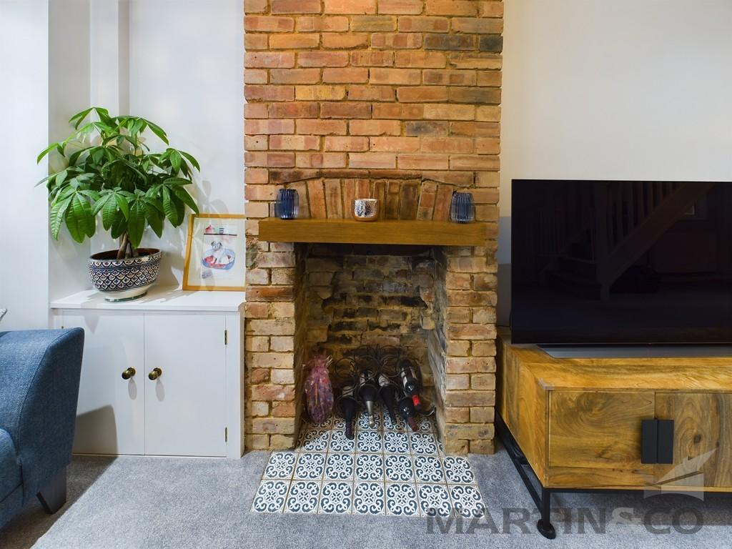 Exposed Brick Fireplace