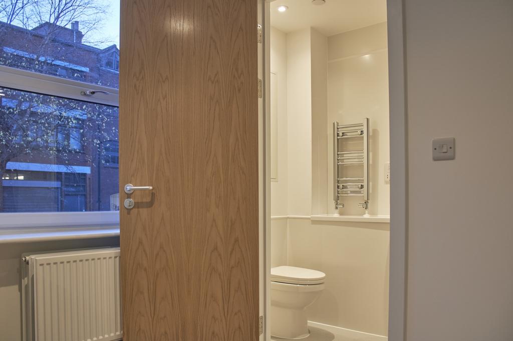 A bright and modern bathroom featuring sleek de...