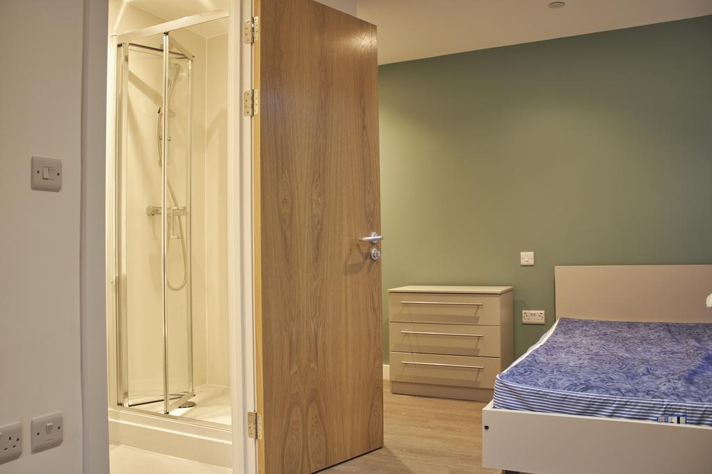 A modern double bedroom featuring a stylish des...