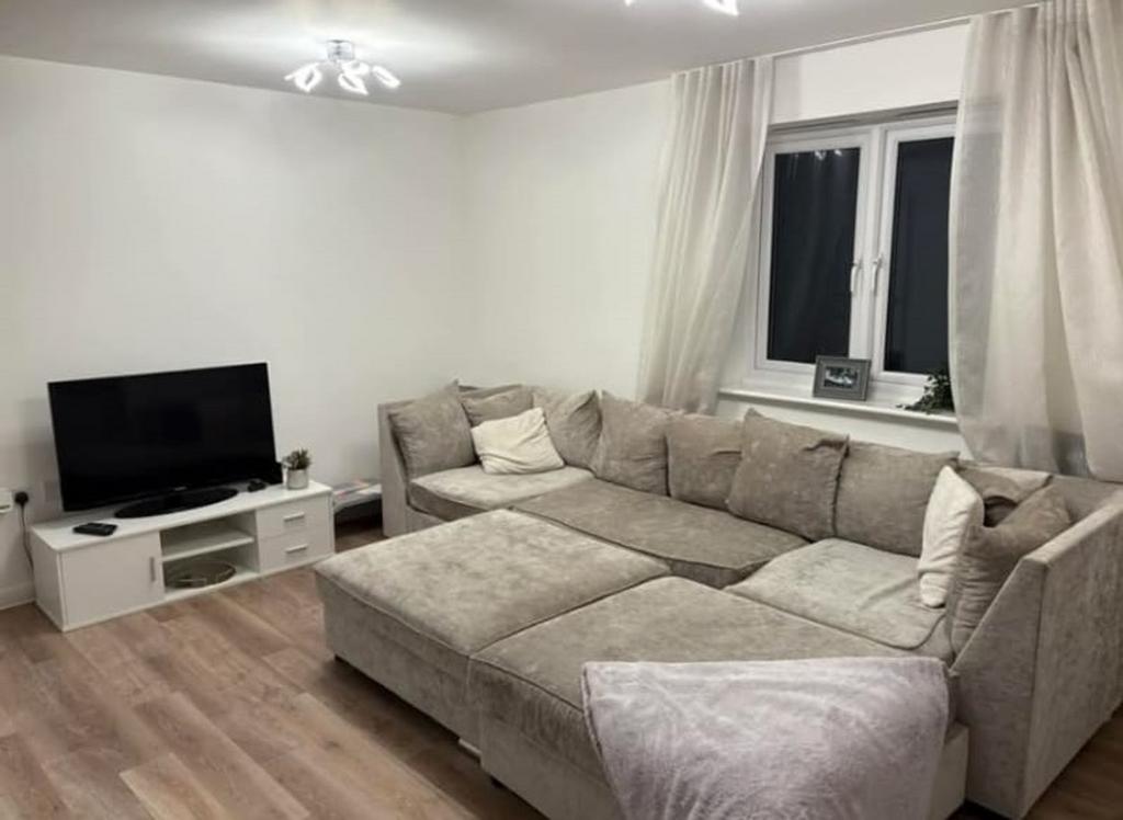 A spacious and inviting modern living room with...