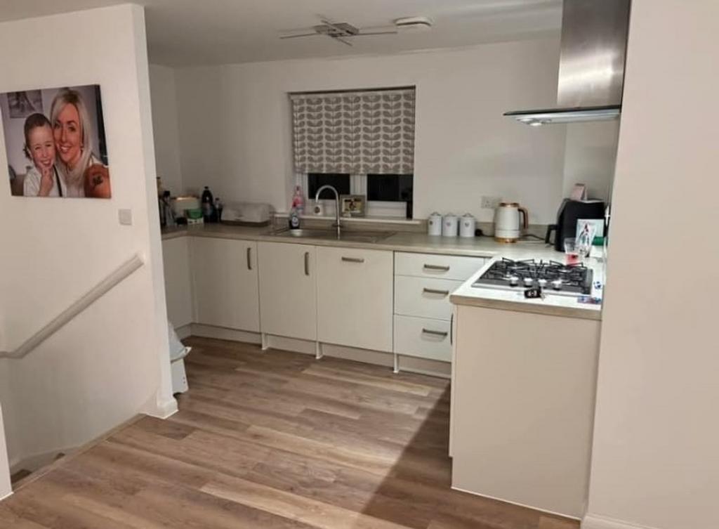A modern and well-maintained kitchenette, featu...