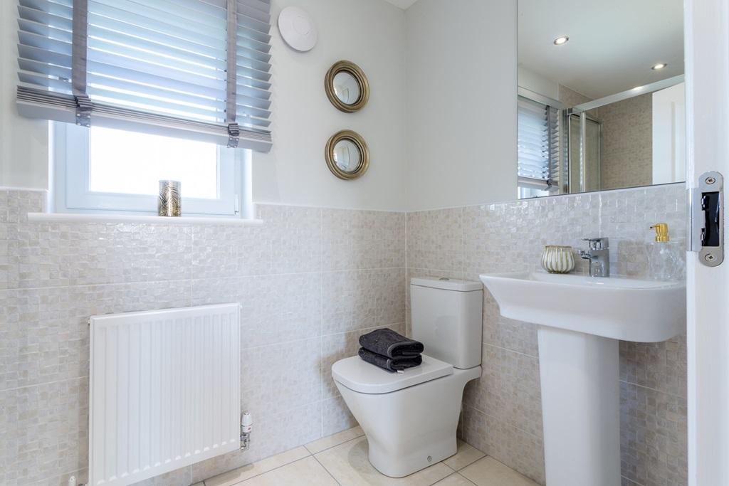 An en suite with shower away from the family