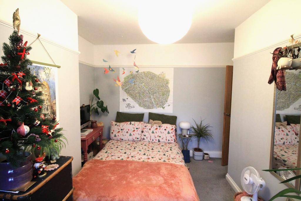 A cozy and inviting double bedroom with charmin...