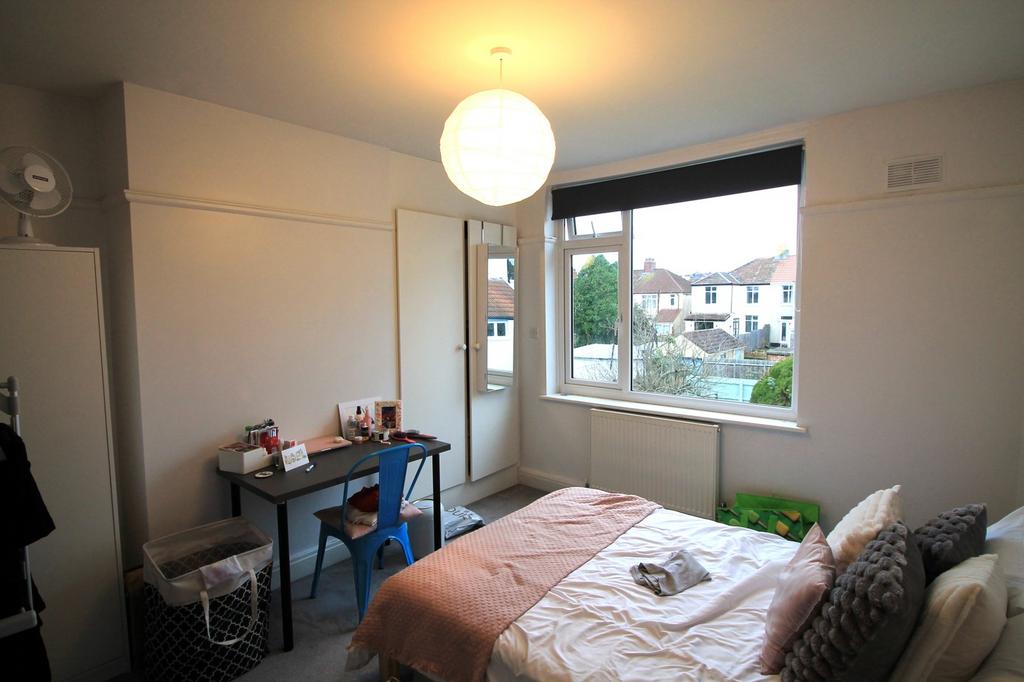 A bright and inviting double bedroom featuring ...