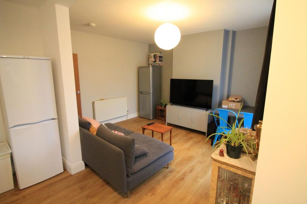 A spacious and inviting modern living room, per...