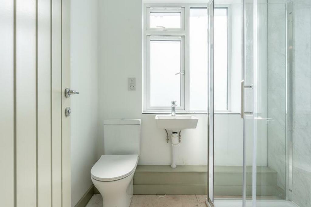 A bright and clean bathroom featuring a modern ...