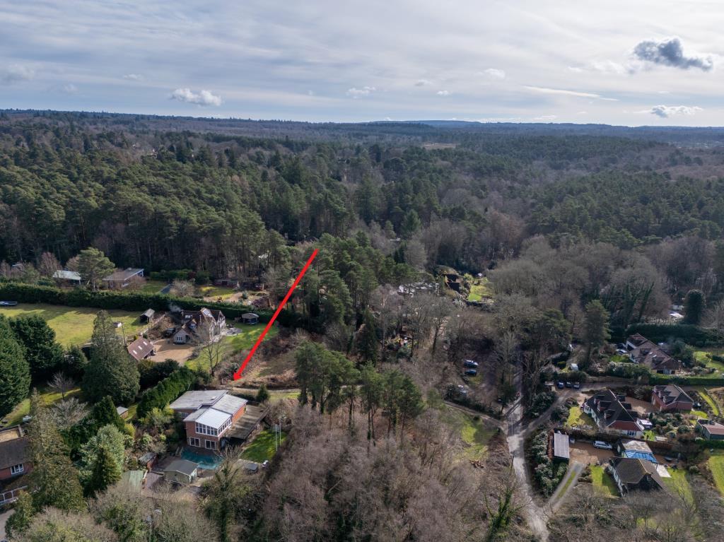 Aerial view showing surrounding properties and loc