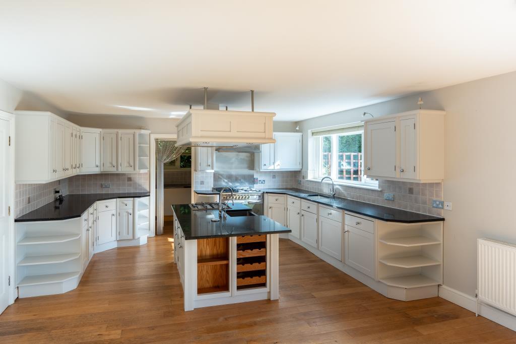 Modern kitchen with island and wood effect floor