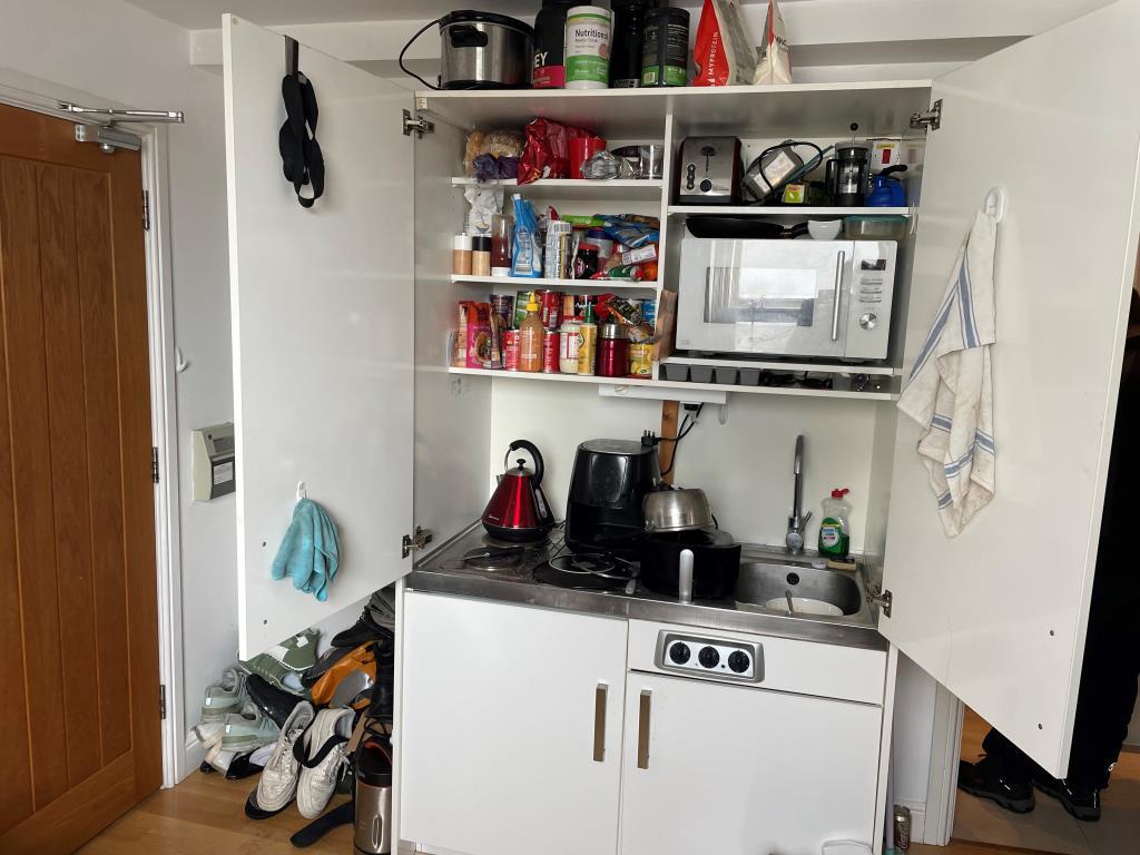 White kitchenette of flat 6