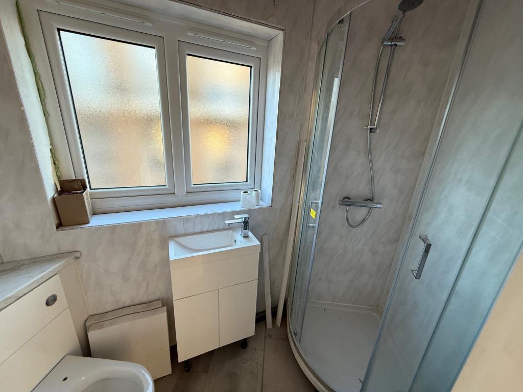 First floor shower room with window to the side
