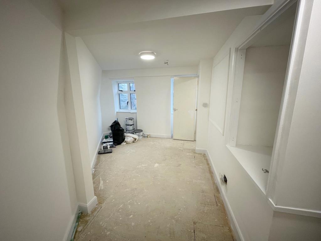 Top floor room looking toward the front of the bui