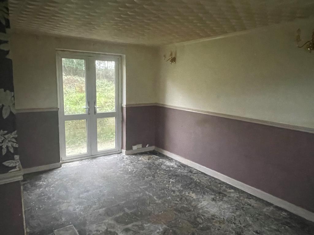 Living room with doors leading to rear