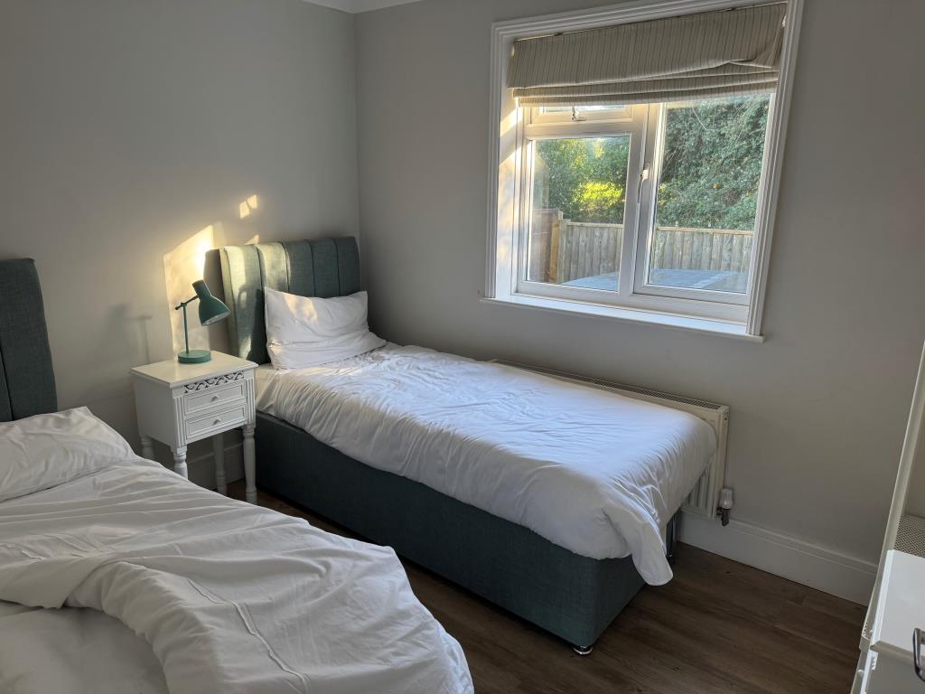The smaller of the two bedrooms