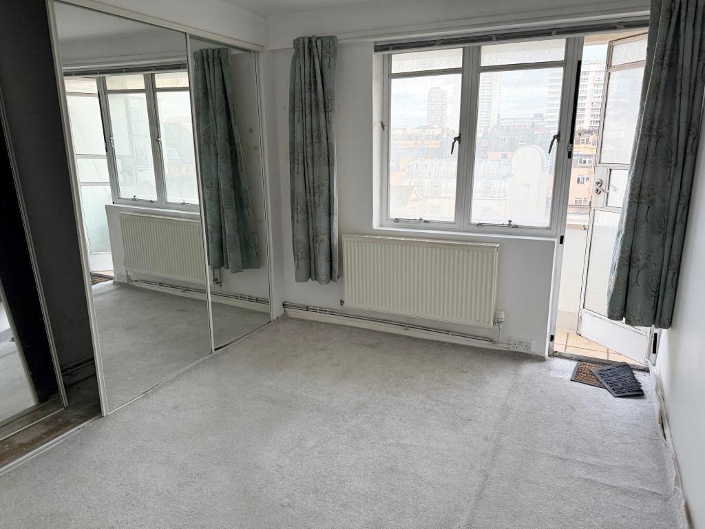 Living room with glazed door to balcony